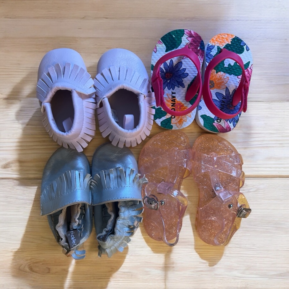 4 pairs of baby girl shoes: 3 unworn, 1 shows wear. Various designers.